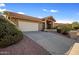 Single-story home with a two-car garage and landscaped yard at 1017 E Grandview Rd, Phoenix, AZ 85022