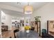 Kitchen view from dining room with round table and pendant lights at 9452 E Saturn Ave, Mesa, AZ 85212