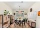 Dining room with round table, light wood cabinets, and white walls at 9452 E Saturn Ave, Mesa, AZ 85212