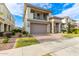 Two-story home with stone accents and a landscaped yard at 9452 E Saturn Ave, Mesa, AZ 85212