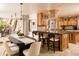 Gourmet kitchen featuring wood cabinets and granite island at 4636 E Moonlight Way, Paradise Valley, AZ 85253