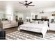 Spacious primary bedroom with large mirror and comfortable seating area at 4636 E Moonlight Way, Paradise Valley, AZ 85253