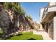Private patio with stone wall and mountain views at 4636 E Moonlight Way, Paradise Valley, AZ 85253