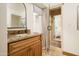 Bathroom with granite vanity and a walk-in shower at 4636 E Moonlight Way, Paradise Valley, AZ 85253