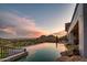Infinity pool with mountain and city views at 4636 E Moonlight Way, Paradise Valley, AZ 85253