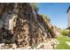 Stunning backyard waterfall feature with lush landscaping at 4636 E Moonlight Way, Paradise Valley, AZ 85253