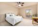 Bedroom with a queen bed, armchair, and large window at 36444 N Stardust Ln, Carefree, AZ 85377