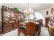 Intricate wood dining set with chandelier, showcasing ornate details at 36444 N Stardust Ln, Carefree, AZ 85377
