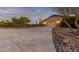Two-car garage with stamped concrete driveway and desert landscaping at 36444 N Stardust Ln, Carefree, AZ 85377