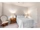 Bedroom with a queen bed and rocking chair at 36444 N Stardust Ln, Carefree, AZ 85377