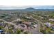 Aerial view of a single-story home with a pool and expansive desert views at 36444 N Stardust Ln, Carefree, AZ 85377