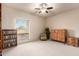 Bedroom with a bookcase, chair, and ample storage at 36444 N Stardust Ln, Carefree, AZ 85377