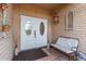 Inviting entryway with double doors and a cozy bench at 36444 N Stardust Ln, Carefree, AZ 85377