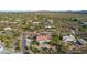 Aerial view of single-story home with pool and surrounding desert landscape at 36444 N Stardust Ln, Carefree, AZ 85377