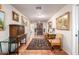 Spacious hallway featuring antique furniture and tile floors at 36444 N Stardust Ln, Carefree, AZ 85377