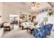 Spacious living room featuring ample seating and large windows at 36444 N Stardust Ln, Carefree, AZ 85377