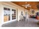 Outdoor patio with tile flooring, ceiling fans, and seating for four at 36444 N Stardust Ln, Carefree, AZ 85377