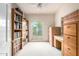 Home office with built-in shelving and desk at 36444 N Stardust Ln, Carefree, AZ 85377