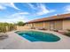 Beautiful kidney-shaped pool and patio with desert landscape views at 36444 N Stardust Ln, Carefree, AZ 85377