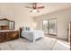 Cozy bedroom with a queen-size bed and ample natural light at 36444 N Stardust Ln, Carefree, AZ 85377