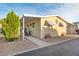 Front view of a yellow single wide mobile home at 11596 W Sierra Dawn Blvd # 40, Surprise, AZ 85378