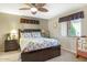 Bright bedroom with a floral comforter and ceiling fan at 11596 W Sierra Dawn Blvd # 40, Surprise, AZ 85378