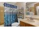 Bathroom with shower, toilet, and vanity with a floral shower curtain at 11596 W Sierra Dawn Blvd # 40, Surprise, AZ 85378