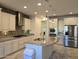 Modern kitchen with island, stainless steel appliances, and granite countertops at 10736 W Paso Trl, Peoria, AZ 85383