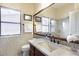 Bathroom with a single sink, glass-enclosed shower, and mosaic tile accents at 22202 N 44Th Pl, Phoenix, AZ 85050