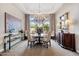 Elegant dining room with a chandelier and seating for six at 4065 N Silver Ridge Cir, Mesa, AZ 85207