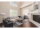 Spacious living room with fireplace and hardwood floors at 6331 W Fullam St, Glendale, AZ 85308