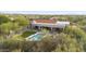 Aerial view showcasing a home's pool, backyard, and mountain views at 7928 E Parkview Ln, Scottsdale, AZ 85255