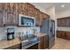 Kitchen features stainless steel appliances and dark wood cabinetry at 5077 E Lonesome Trl, Cave Creek, AZ 85331