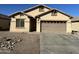 One-story house with brown garage door at 11560 W Kinderman Dr, Avondale, AZ 85323