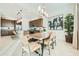 Kitchen dining area with wood table and modern chairs at 3297 E Saddletree Way, San Tan Valley, AZ 85140