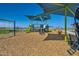 Community playground with shaded areas, slides, and swings at 3297 E Saddletree Way, San Tan Valley, AZ 85140