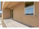 Backyard view with sliding glass door and neutral colored walls at 18197 W Cielo Grande Ave, Surprise, AZ 85387