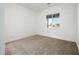 Spacious bedroom featuring carpeted floors and a window at 15435 W Bajada Dr, Surprise, AZ 85387