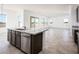 Open concept kitchen with island and stainless steel appliances at 15435 W Bajada Dr, Surprise, AZ 85387