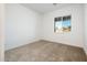 Bright bedroom with carpeted floor and window with a view at 15435 W Bajada Dr, Surprise, AZ 85387