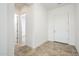 Bright entryway with tile flooring and access to other rooms at 15435 W Bajada Dr, Surprise, AZ 85387
