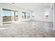 Bright Gathering room with tile floors and sliding glass doors at 15435 W Bajada Dr, Surprise, AZ 85387