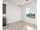 Bright dining area with tile flooring and large window offering scenic views at 15435 W Bajada Dr, Surprise, AZ 85387