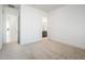 Well-lit bedroom with access to bathroom and hallway at 15435 W Bajada Dr, Surprise, AZ 85387