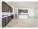 Open concept kitchen with an island, gray cabinets, and granite countertops at 15435 W Bajada Dr, Surprise, AZ 85387