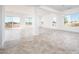 Spacious dining area with large windows and tile floors at 15435 W Bajada Dr, Surprise, AZ 85387