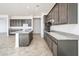 Modern kitchen with ample cabinetry and granite countertops at 15435 W Bajada Dr, Surprise, AZ 85387