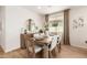 Dining area with wooden table and neutral decor at 18252 W Cielo Grande Ave, Surprise, AZ 85387