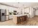 Modern kitchen with island and stainless steel appliances at 18252 W Cielo Grande Ave, Surprise, AZ 85387