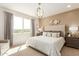 Bright bedroom with large bed and wall decor at 18252 W Cielo Grande Ave, Surprise, AZ 85387